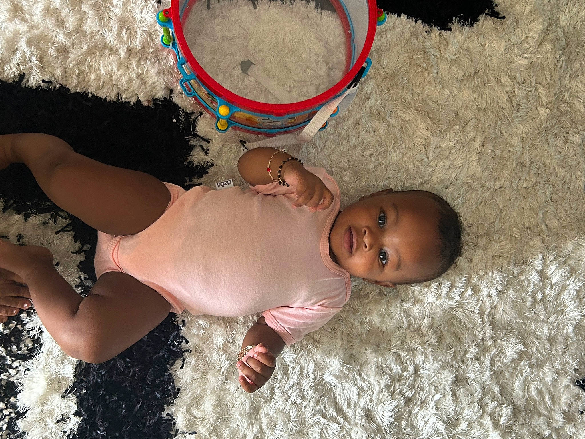 Sariyah joined the competition — help win amazing prizes! abdomen, baby, beach, chest, child, elbow, fun, grass, hand, happy, human_body, human_leg, leg, leisure, people_in_nature, person, thigh, toddler, toy, trunk