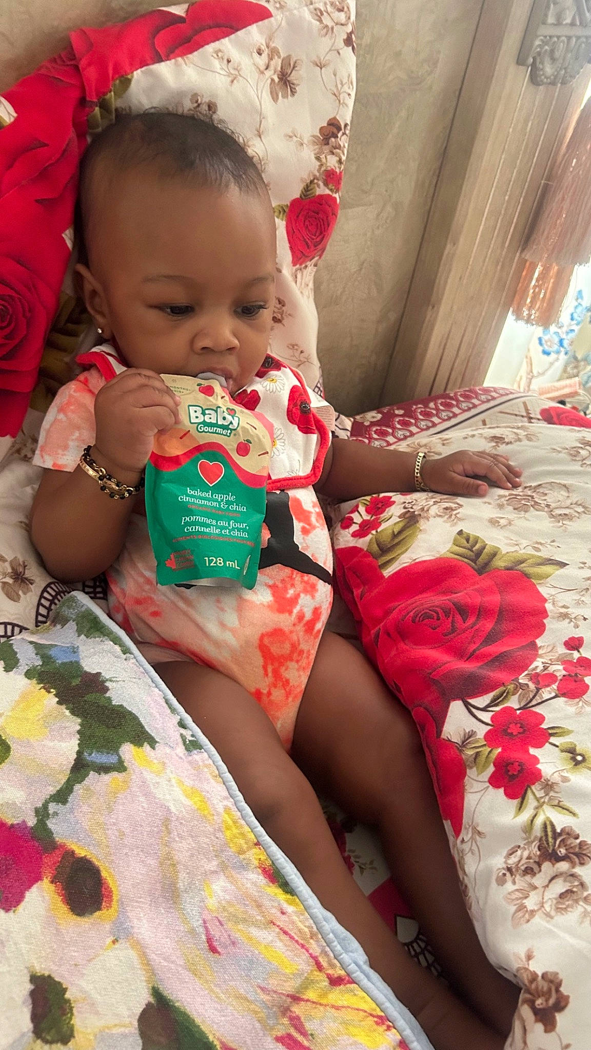 Sariyah is registered to the contest to win money with this photo: baby, baby_toddler_clothing, cheek, dress, eye, facial_expression, finger, hair, hairstyle, hand, happy, iris, lip, mouth, person, pink, red, skin, textile, thigh