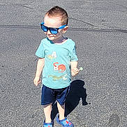 Phoenix joined the competition — help win amazing prizes! child, boy, sunglasses, tshirt, dinosaur, lollipop, shorts, shoes, outdoor, sunny, shadow, asphalt, standing, casual, cute, fashion, summer, happy, kid, playground
