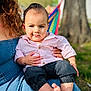 Adrián is registered to the contest to win money with this photo: baby, child, infant, person, outdoor, nature, tree, hammock, clothing, shirt, pants, barefoot, hand, lap, grass, sunlight, portrait, cute, casual, family