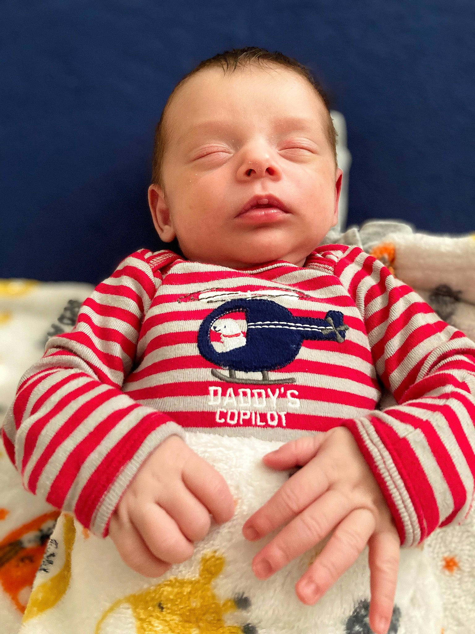 Gilbert is registered to the contest to win money with this photo: baby, baby_food, baby_toddler_clothing, bib, cheek, child, chin, comfort_food, finger, happy, head, nose, person, sitting, skin, sleeve, sweetness, t_shirt, textile, toddler