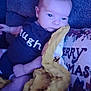Clarence is registered to the contest to win money with this photo: baby, blanket, christmas, clothing, comfort, couch, cozy, cute, fabric, face, holiday, home, indoors, infant, person, pillow, resting, smiling, soft, young_child