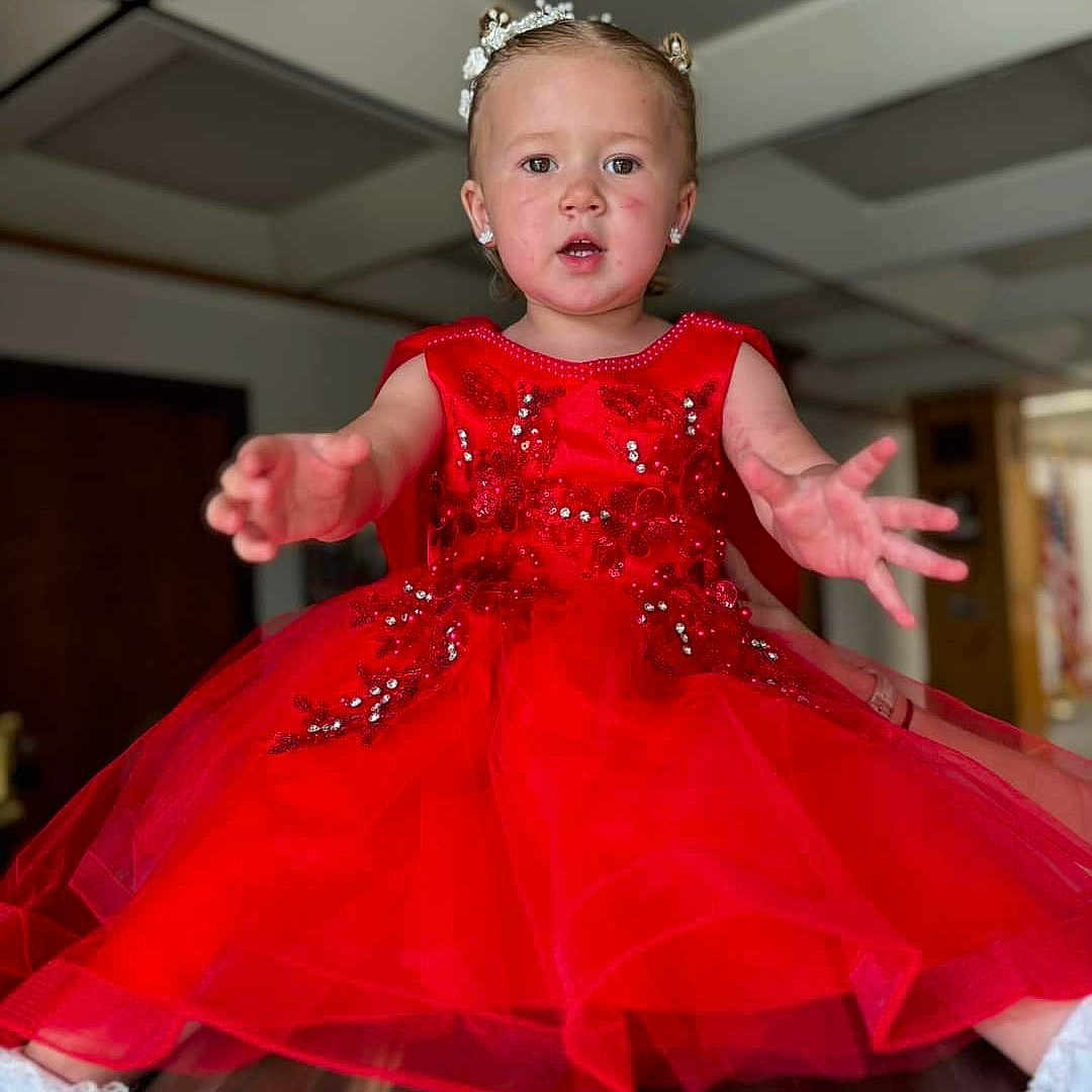 Enzleigh is registered to the contest to win money with this photo: accessories, baby, bodypart, clothing, costume, dress, eveningdress, face, fashion, finger, formalwear, gown, hand, head, jewelry, person, photography, portrait, wedding, weddinggown