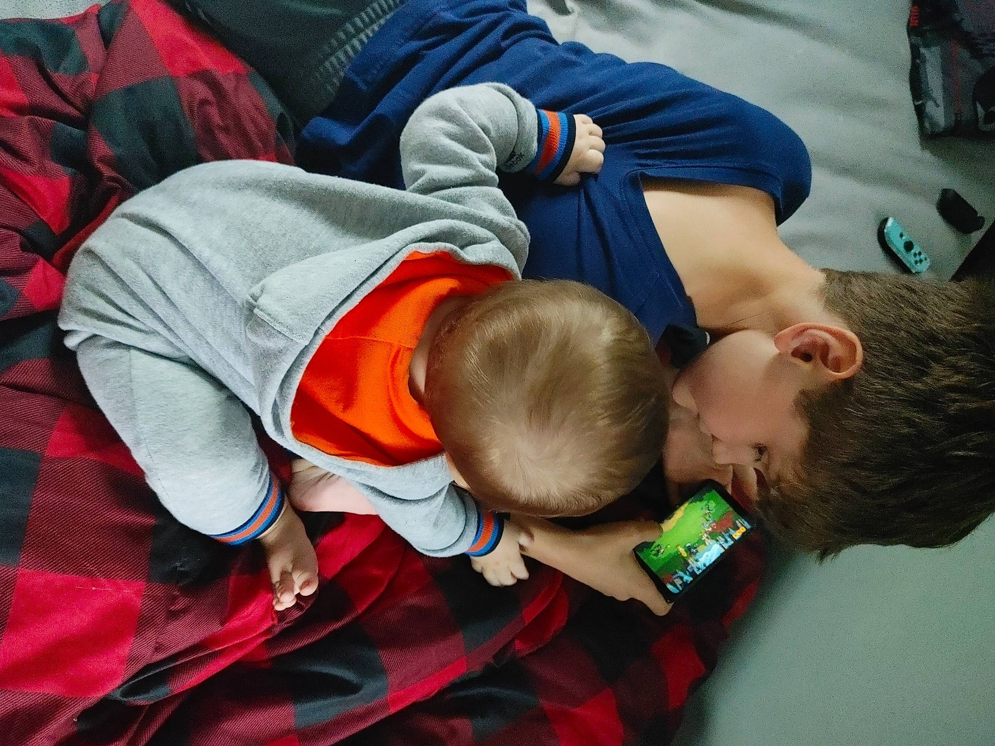 William is registered to the contest to win money with this photo: baby, baby_products, baby_toddler_clothing, carmine, child, comfort, event, facial_expression, flooring, fun, gesture, happy, head, mammal, nap, pattern, person, play, sitting, sleep