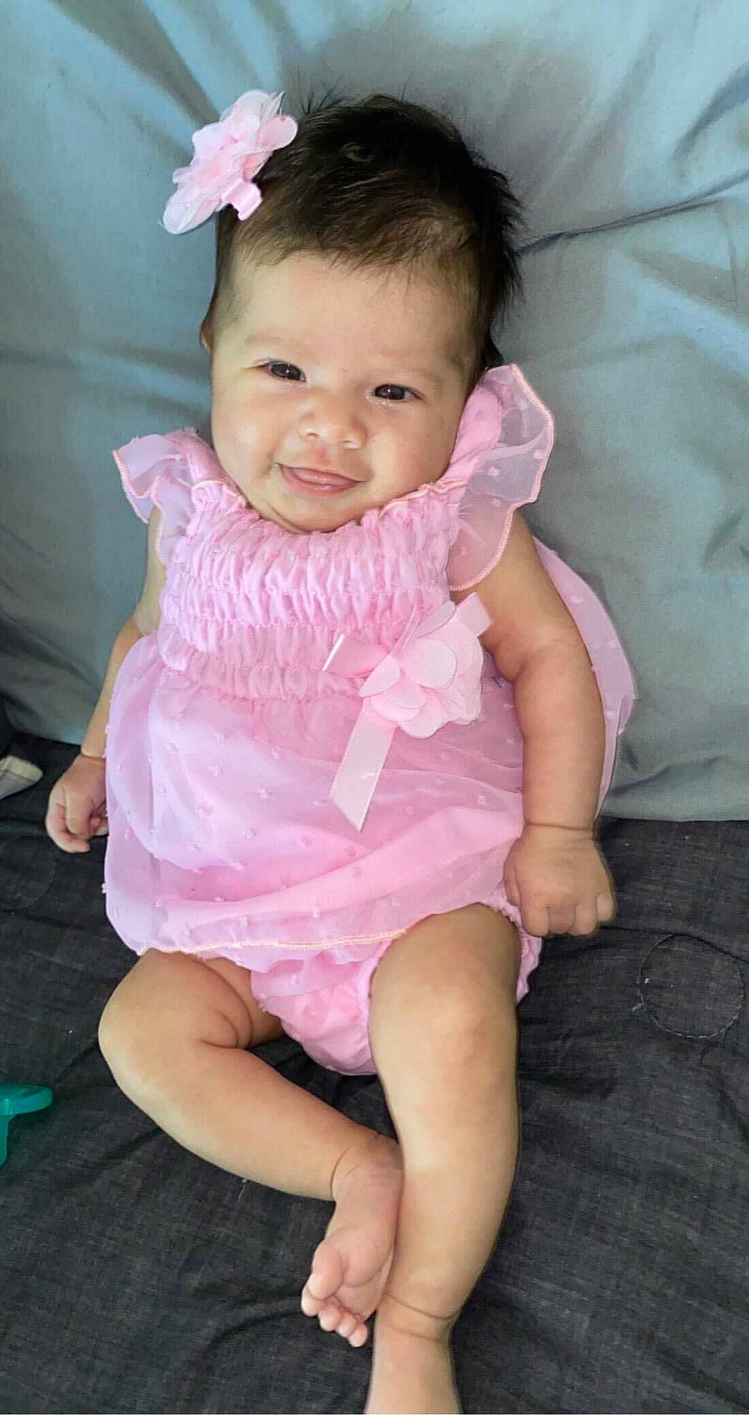 Areli is registered to the contest to win money with this photo: baby, baby_toddler_clothing, cheek, child, dress, eye, eyelash, face, fun, happy, human_body, human_leg, iris, magenta, person, pink, purple, skin, sleeve, smile