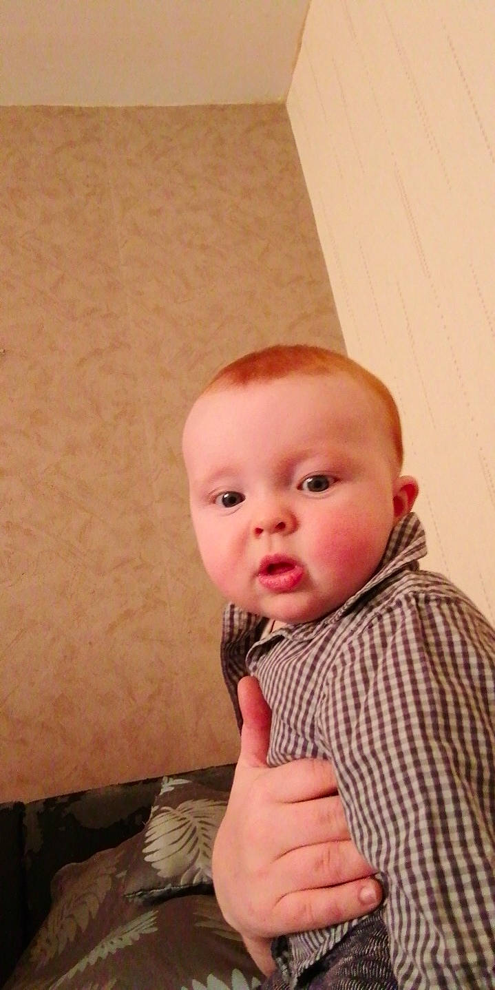 Bellamy participe au concours pour gagner de l'argent avec cette photo : baby, baby_toddler_clothing, cheek, child, comfort, eye, eyelash, face, flooring, fur, head, iris, nose, pattern, person, room, skin, sleeve, t_shirt, toddler