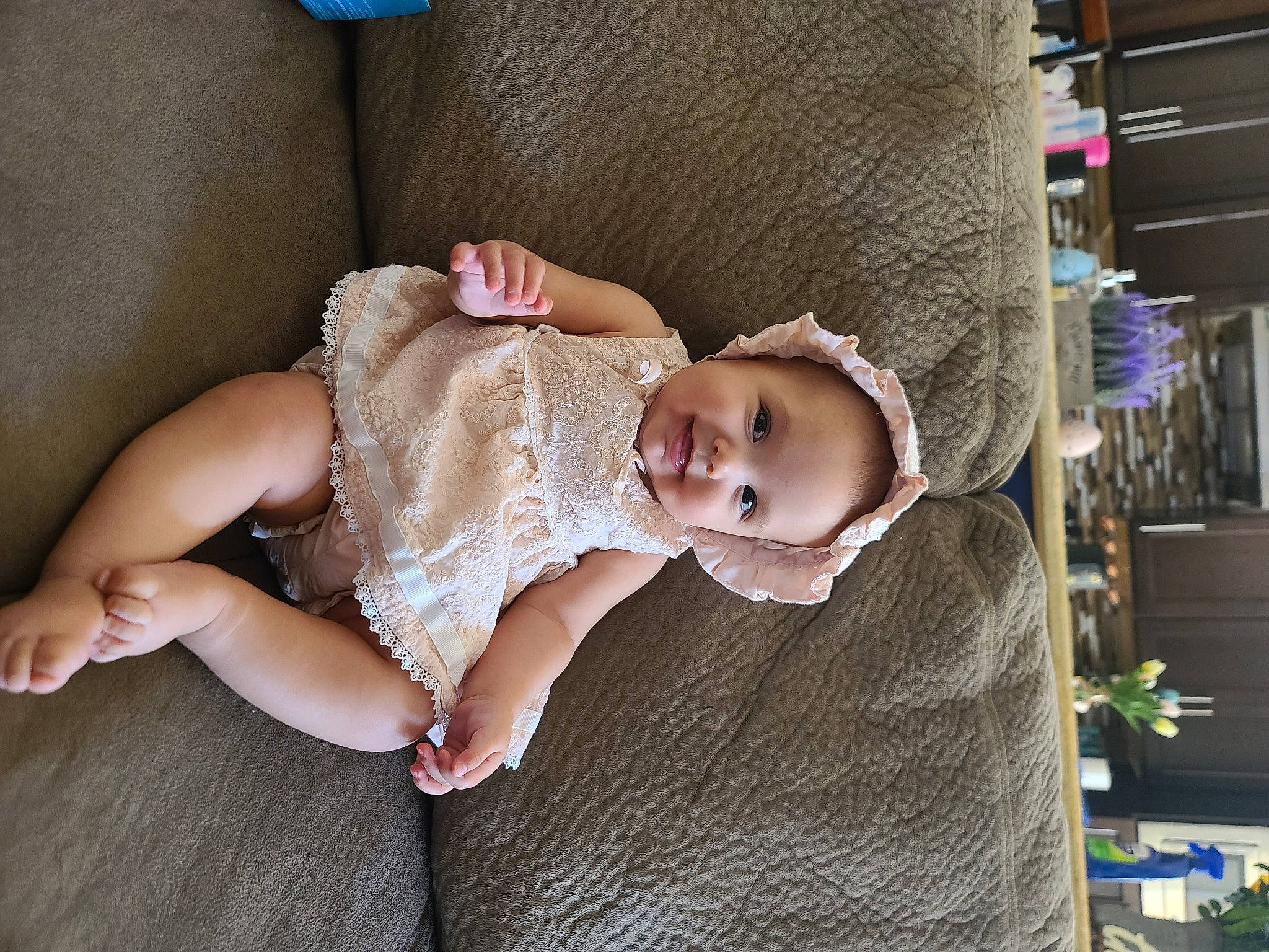 Scarlett is registered to the contest to win money with this photo: baby, baby_products, baby_toddler_clothing, blue, cheek, child, comfort, eye, fashion_accessory, flooring, head, iris, joy, linens, pattern, person, portrait_photography, room, sitting, skin