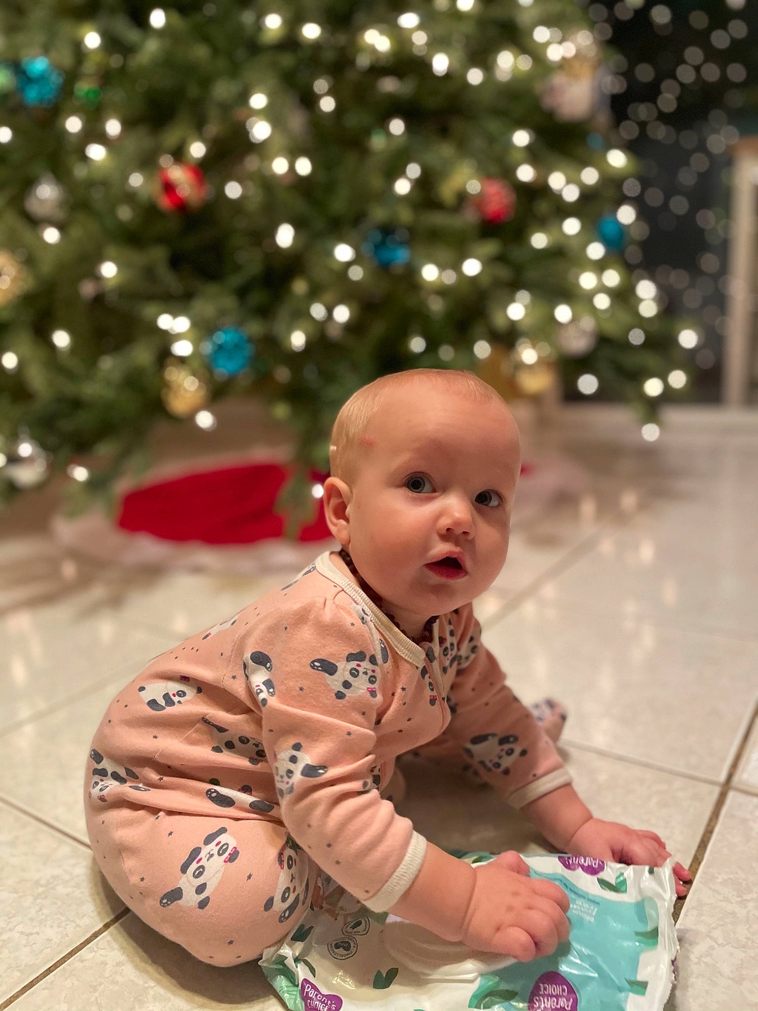 Avery joined the competition — help win amazing prizes! baby, baby_products, baby_toddler_clothing, cheek, child, christmas, christmas_decoration, christmas_eve, christmas_lights, christmas_ornament, christmas_tree, conifer, fir, holiday, holiday_ornament, interior_design, ornament, person, pine_family, surprise