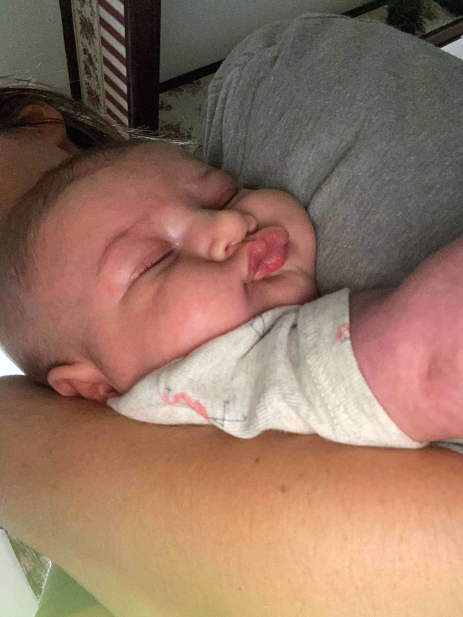 Braylee is registered to the contest to win money with this photo: abdomen, baby, baby_sleeping, cheek, chest, childbirth, comfort, elbow, gesture, hand, human_leg, joint, linens, mouth, nail, neck, person, skin, stomach, thumb