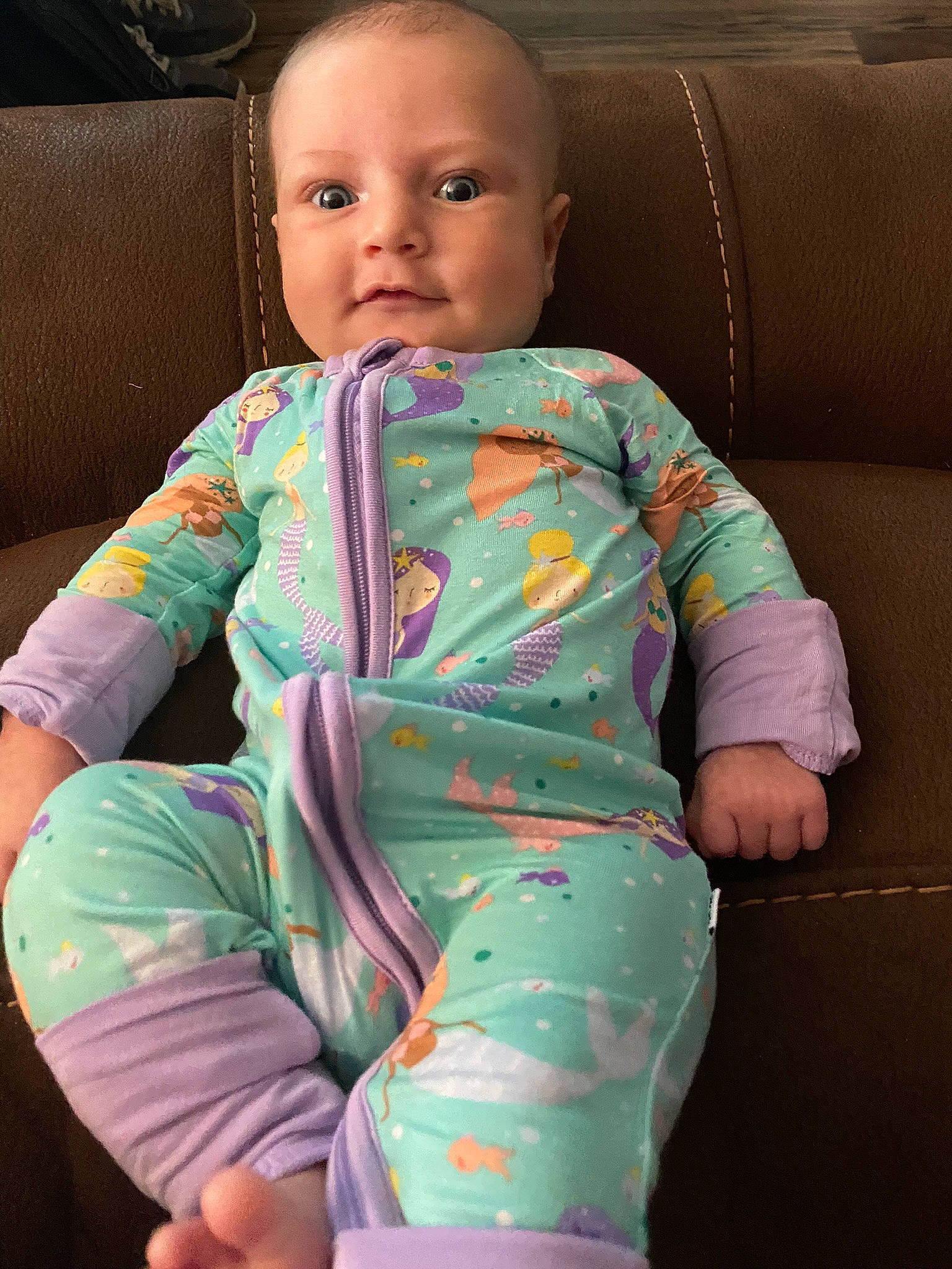 Braylee is registered to the contest to win money with this photo: arm, baby, baby_toddler_clothing, cheek, chin, comfort, dress, eye, face, finger, hand, head, human_body, iris, mouth, neck, nose, person, skin, sleeve