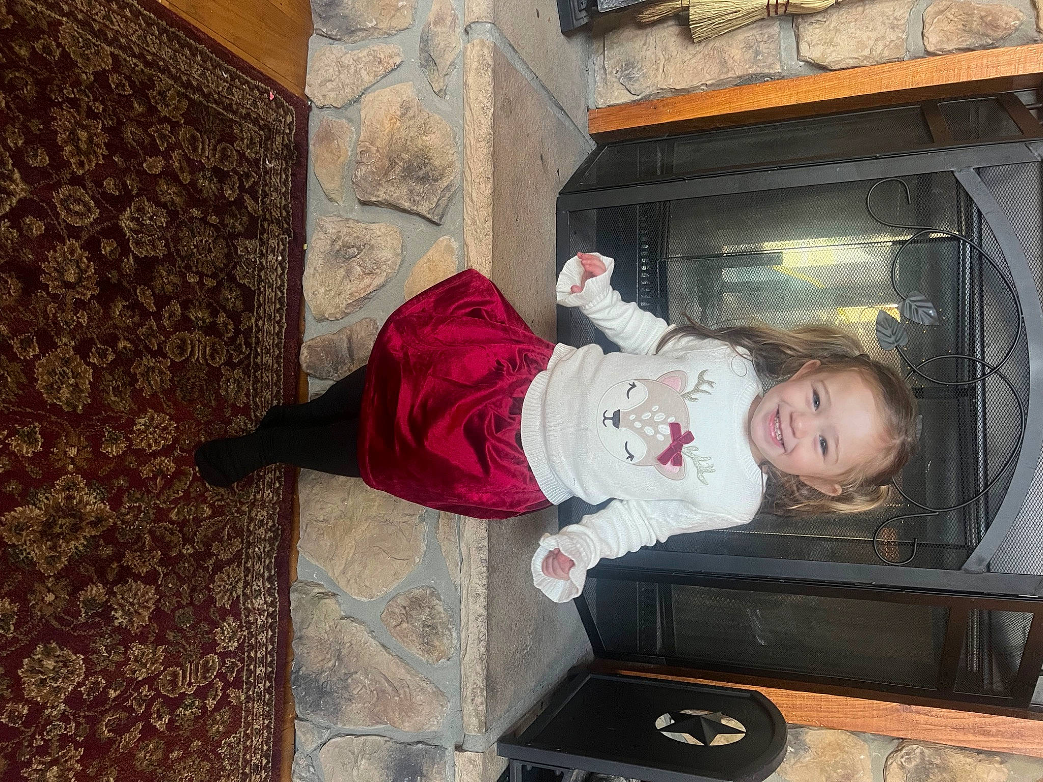 Oakley is registered to the contest to win money with this photo: baby_toddler_clothing, child, door, flooring, fun, hat, house, joy, magenta, person, room, sitting, toddler, tree, window, wood