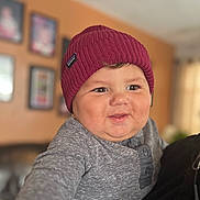 Jay joined the competition — help win amazing prizes! baby, blurred_background, buttoned_shirt, child, chubby_cheeks, cozy, curious, cute, face, furniture, gray_shirt, happy, hat, indoor, knit_hat, living_room, person, portrait, smile, warm_lighting