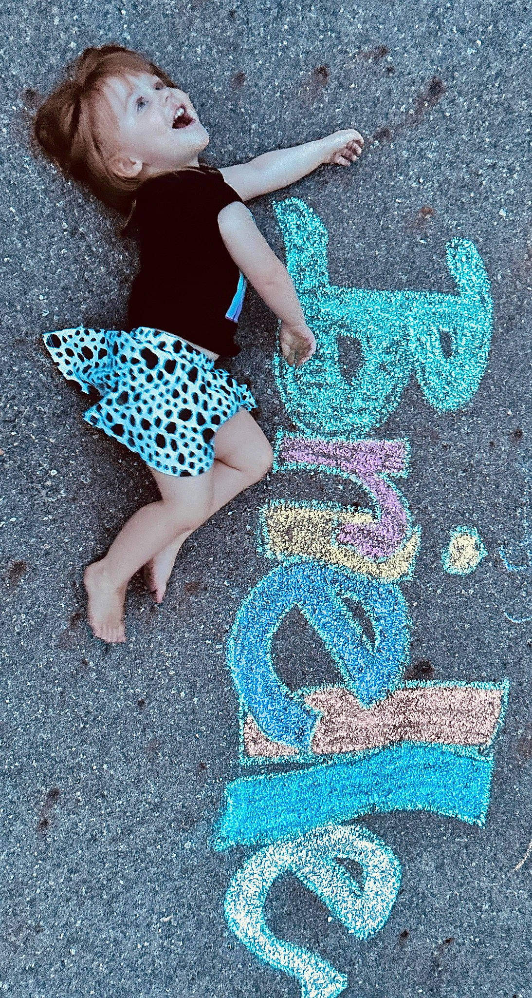 Brielle joined the competition — help win amazing prizes! aqua, art, asphalt, azure, blue, chalk, electric_blue, flash_photography, font, fun, grass, happy, human_leg, pattern, people_in_nature, person, photograph, road_surface, sidewalk, snapshot