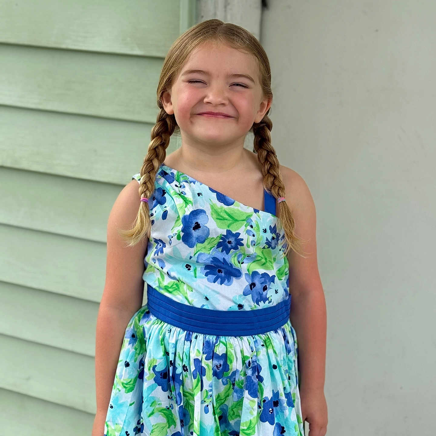 Braylee Selby is registered to the contest to win money with this photo: background, braids, casual, child, colorful_clothing, cute, dress, expression, fashion, floral_pattern, girl, hair, happy, outdoor, person, portrait, smile, standing, summer, young