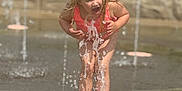 Braylee Selby is registered to the contest to win money with this photo: activity, barefoot, child, clothing, daylight, expression, fountain, fun, happy, joy, outdoor, park, person, playground, recreation, splash, summer, water, waterplay, wet
