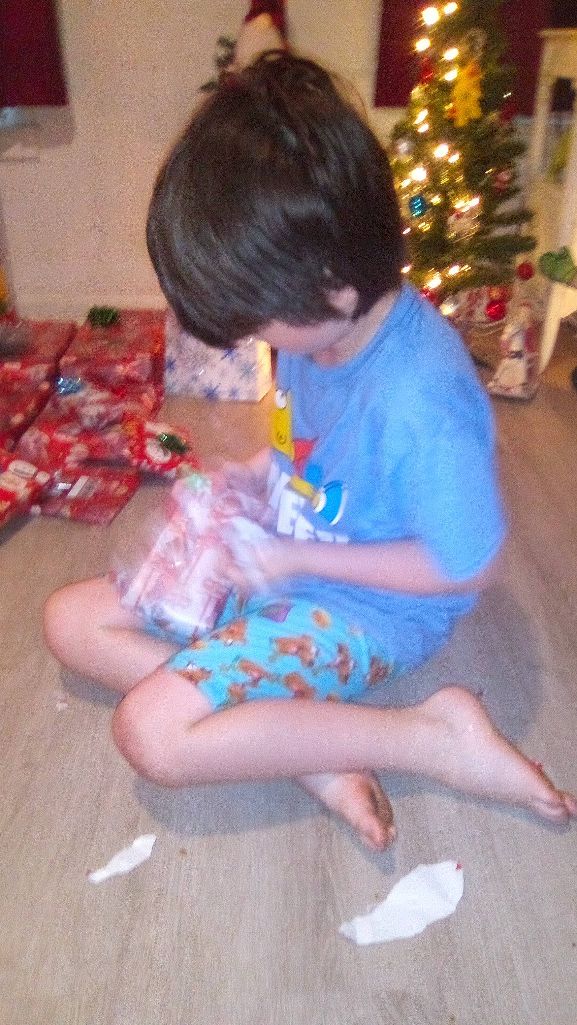 George Williams joined the competition — help win amazing prizes! baby_toddler_clothing, barefoot, child, christmas_tree, event, flooring, foot, fun, happy, holiday, human_body, human_leg, knee, lap, leg, person, play, sitting, thigh, toddler