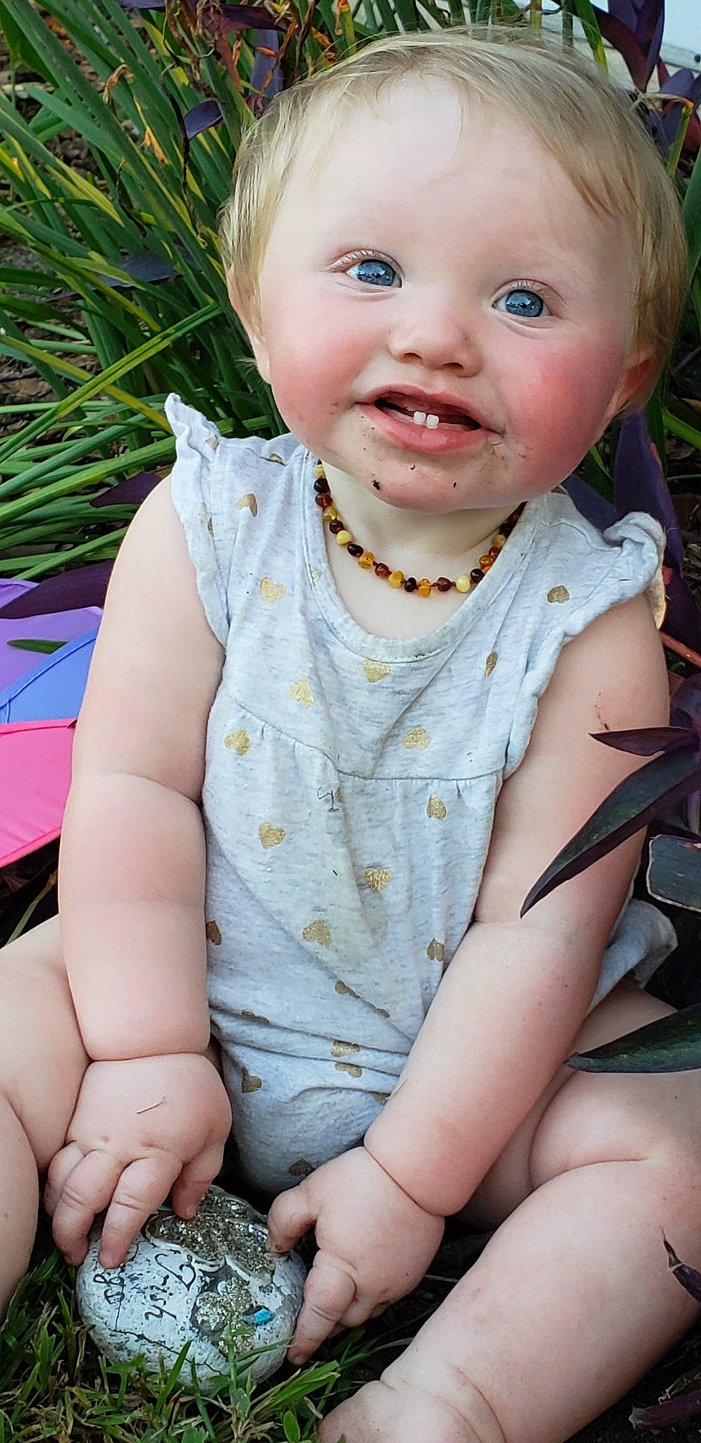 Danica is registered to the contest to win money with this photo: beauty, blond, boy, cheek, child, emotion, eye, facial_expression, fun, girl, grass, hair, happiness, human_hair_color, infant, person, pink, sitting, skin, smile