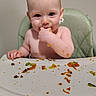 Quentinn is registered to the contest to win money with this photo: baby, child, cute, dining, eating, face, feeding, food, hand, happy, high_chair, indoor, infant, messy, mouth, person, plate, seat, skin, table