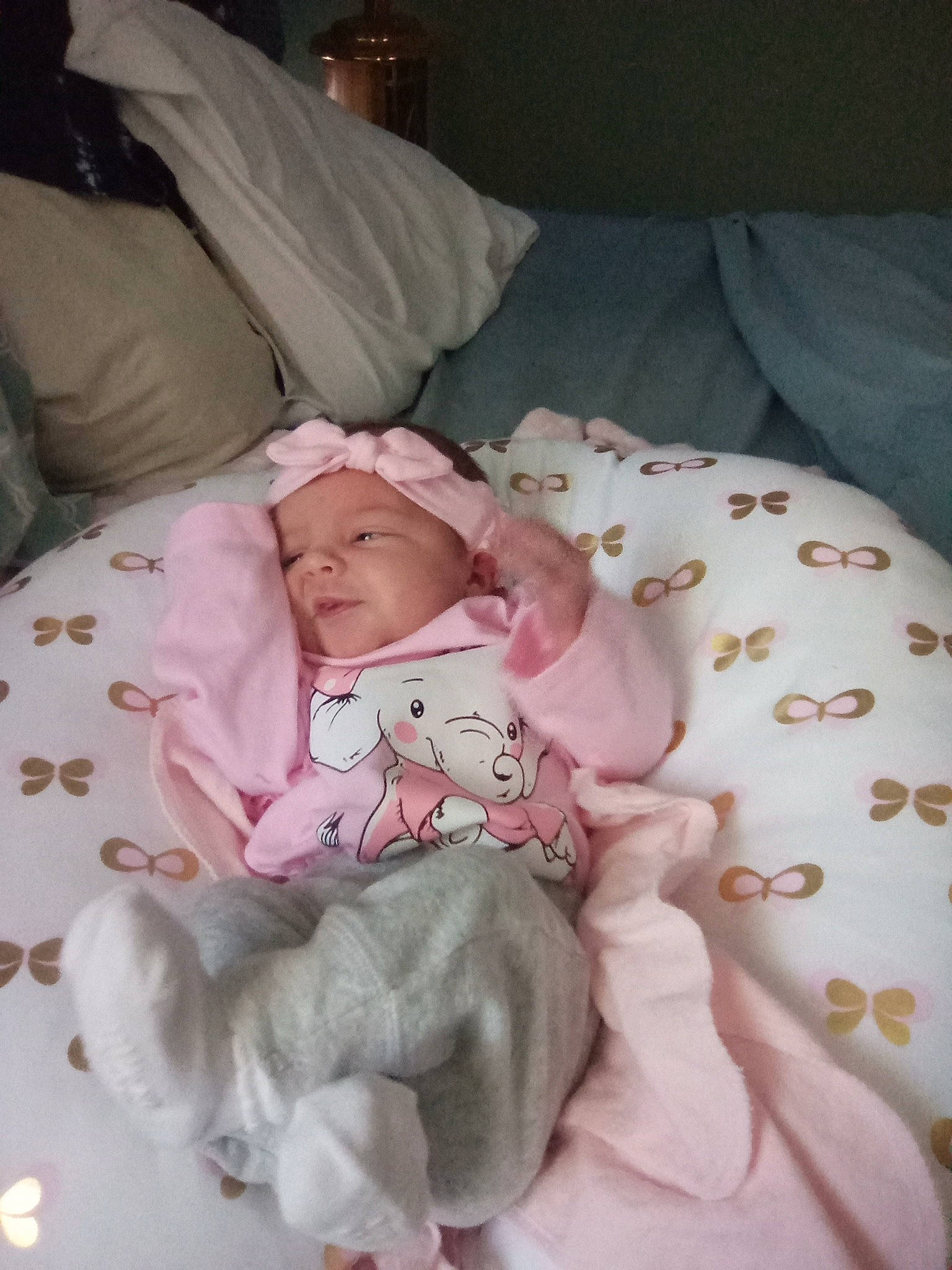 Rebecca is registered to the contest to win money with this photo: baby, baby_products, baby_sleeping, baby_toddler_clothing, bed, bed_sheet, bedding, bedtime, cheek, child, comfort, cradle, headwear, infant_bed, linens, nap, person, pink, room, textile