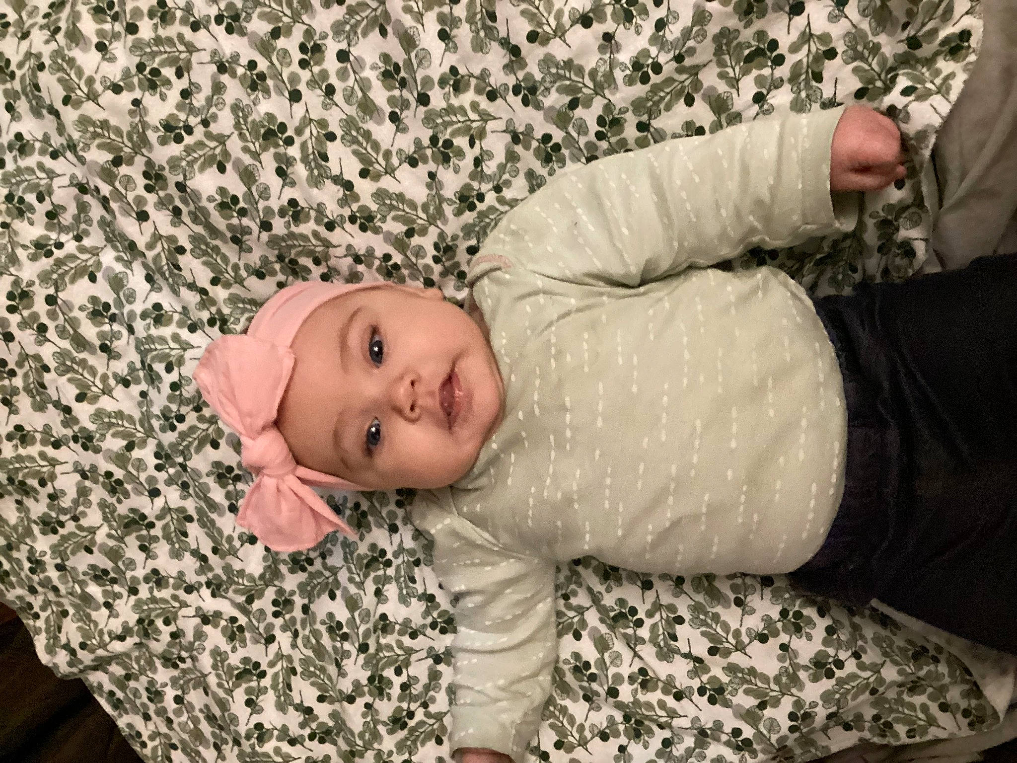 Mabel is registered to the contest to win money with this photo: baby, baby_toddler_clothing, child, comfort, eye, flash_photography, flooring, fun, fur, grass, head, headwear, human_leg, pattern, person, room, sitting, skin, sleeve, textile