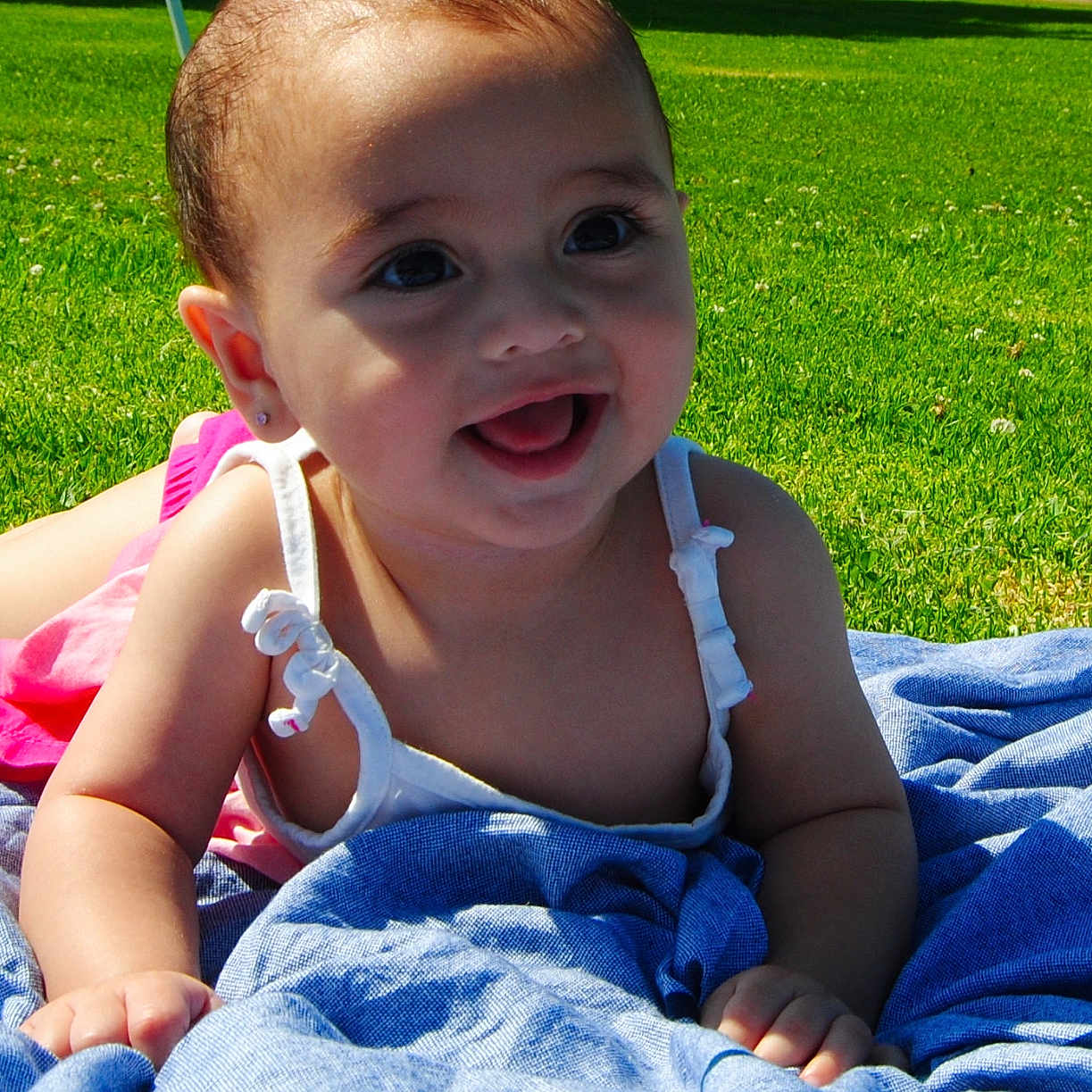 Aletha joined the competition — help win amazing prizes! baby, blanket, child, clothing, cute, daylight, earrings, face, grass, greenery, happy, nature, outdoor, person, portrait, skin, smile, summer, sunlight, toddler
