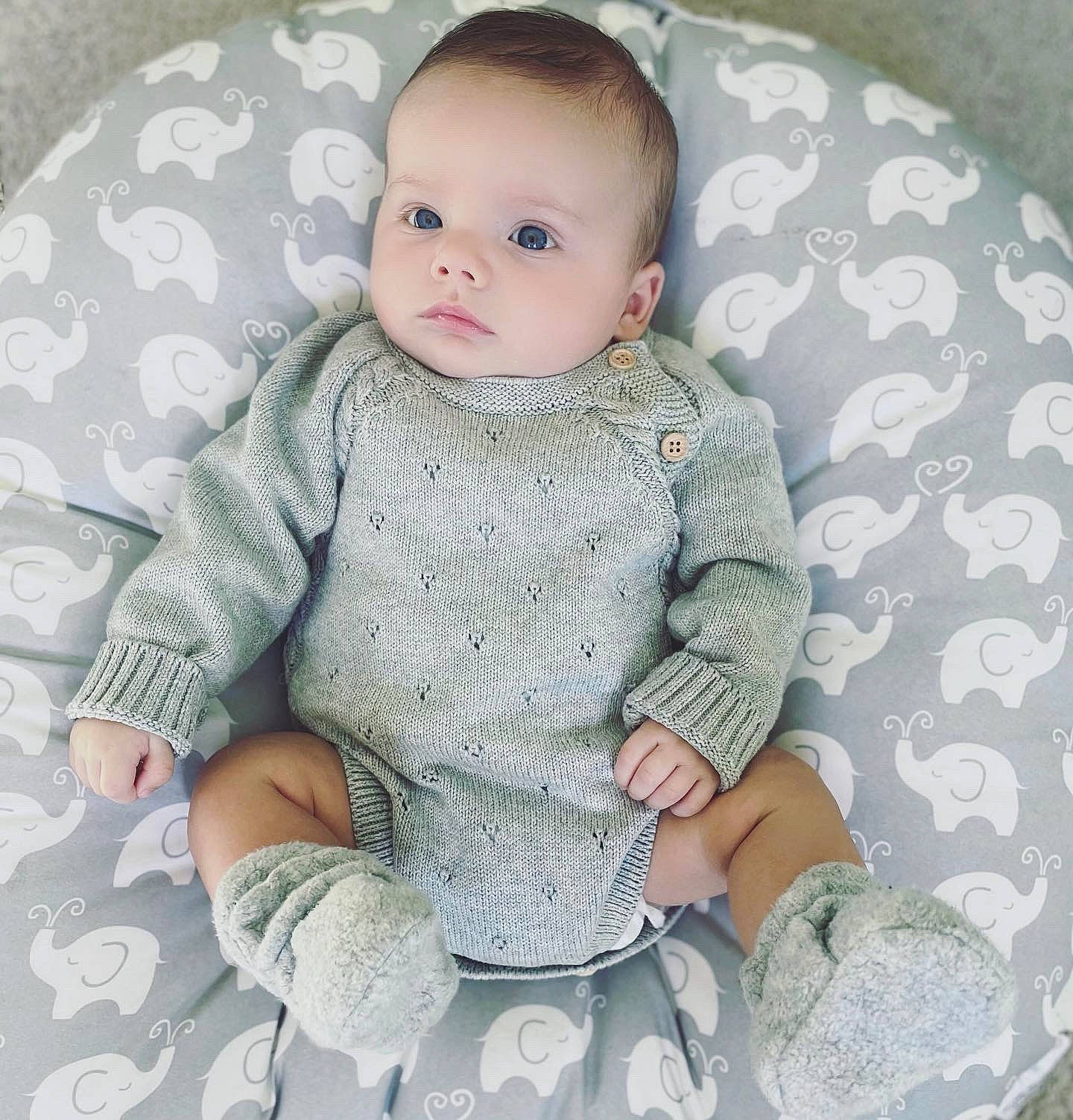 Wolf is registered to the contest to win money with this photo: baby, baby_products, baby_toddler_clothing, cheek, child, creative_arts, embellishment, knitting, linens, pattern, person, skin, sleeve, sweater, textile, toddler, wool, woolen