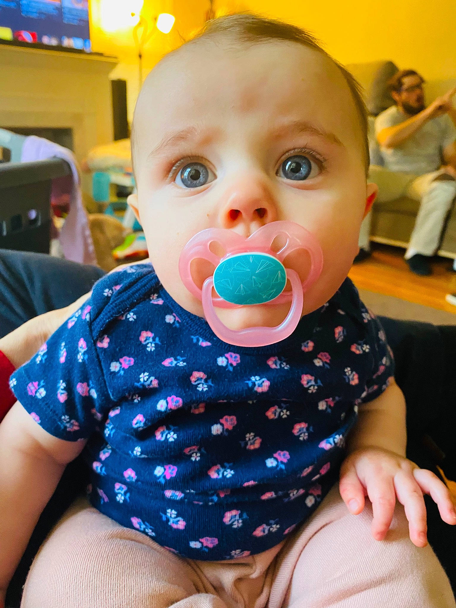 Elle is registered to the contest to win money with this photo: baby, baby_toddler_clothing, beauty, cheek, child, circle, drinkware, eyelash, finger, fun, happy, leisure, mouth, nail, pattern, person, sitting, sleeve, thigh, toddler