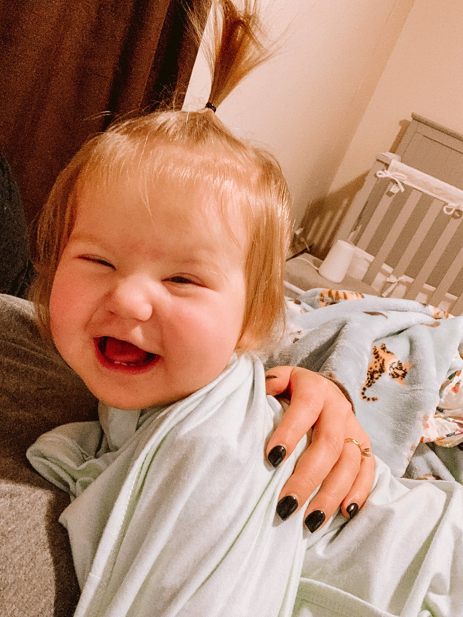 Holland joined the competition — help win amazing prizes! baby, baby_toddler_clothing, bedding, blond, cheek, child, comfort, eye, eyelash, face, happy, head, iris, linens, person, room, sitting, skin, sleeve, smile