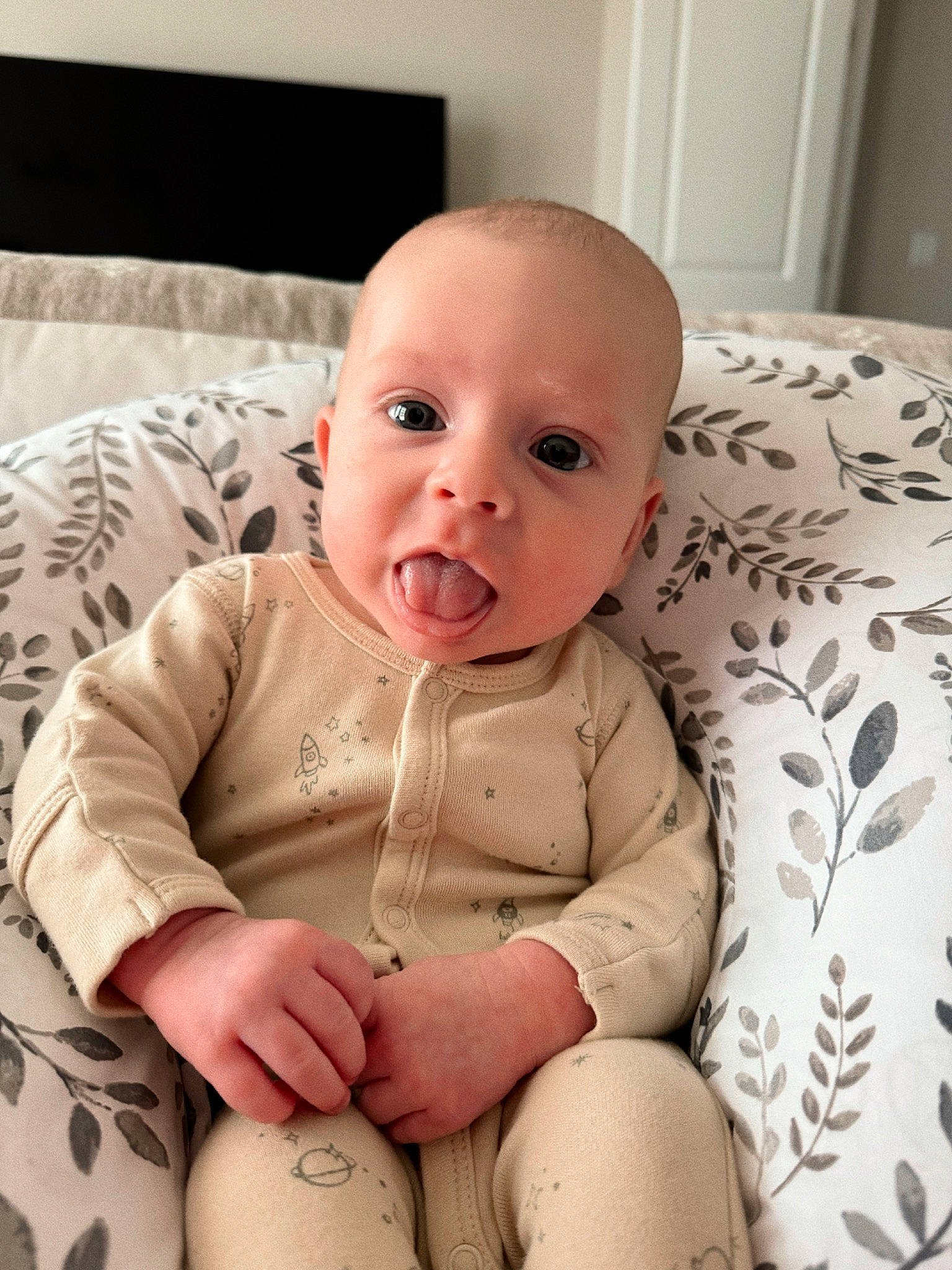 Dallas is registered to the contest to win money with this photo: baby, baby_toddler_clothing, cheek, chin, comfort, eye, face, finger, flooring, head, human_body, iris, linens, lip, mouth, nose, person, skin, sleeve, stomach