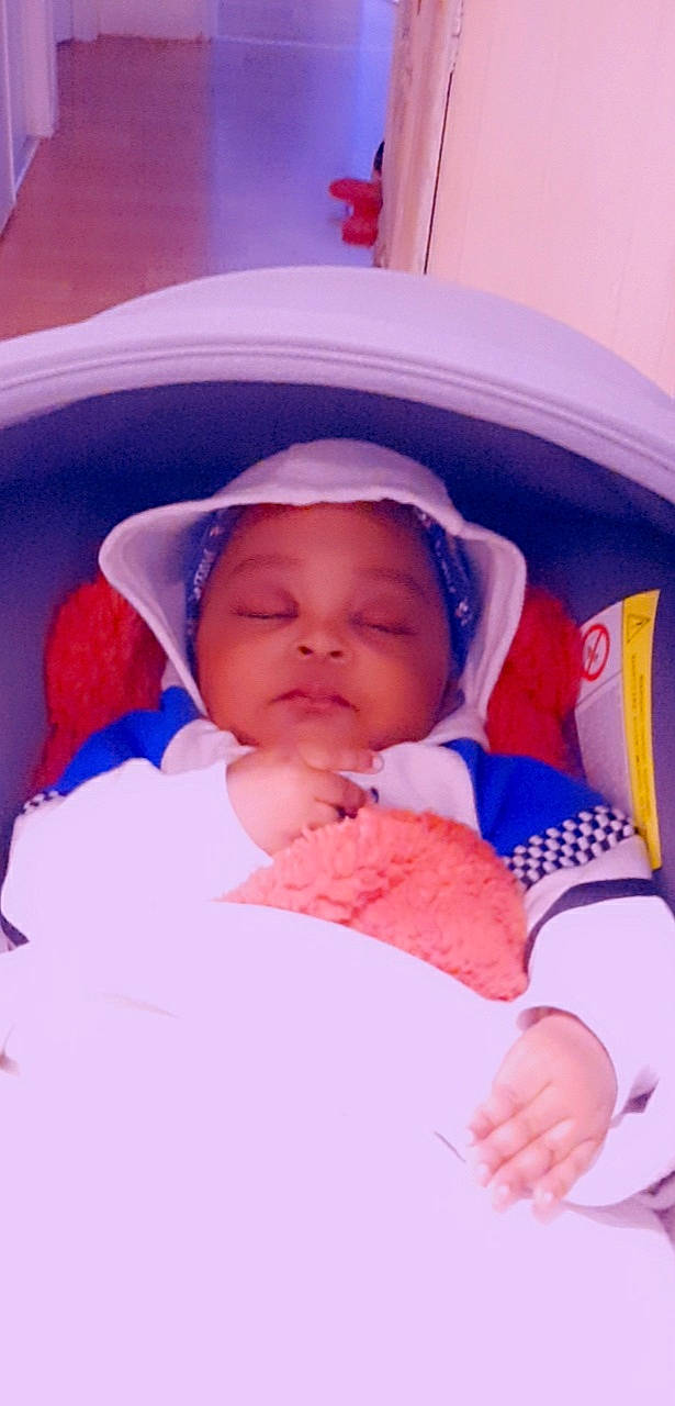 Mamadou Diego Kouyate participe au concours pour gagner de l'argent avec cette photo : azure, baby, baby_products, baby_sleeping, baby_toddler_clothing, bedtime, cheek, child, chin, comfort, happy, headwear, linens, mouth, nose, person, pink, product, skin, textile