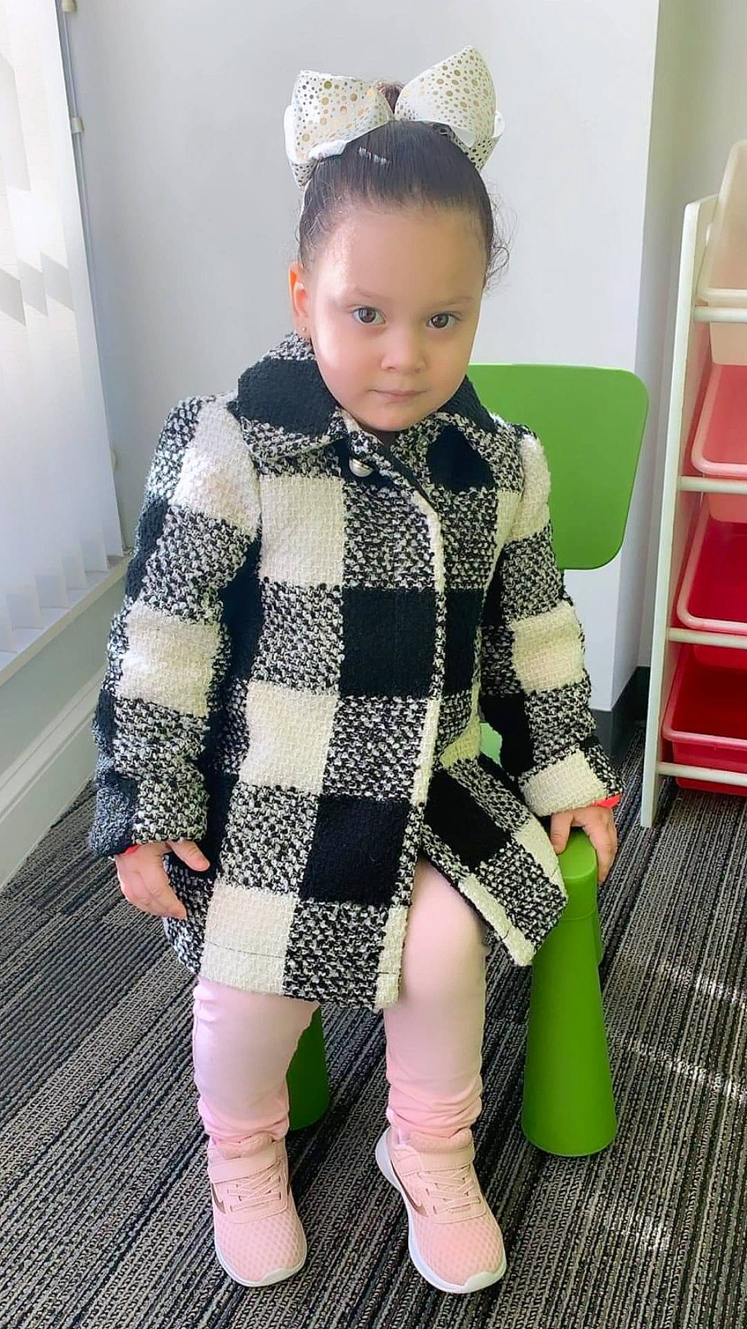 Danisha is registered to the contest to win money with this photo: baby_toddler_clothing, blazer, child, collar, dress, face, fashion, fashion_design, hair, hairstyle, head, headgear, jewellery, knee, neck, pattern, person, sleeve, sock, thigh