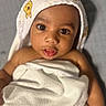 Phoenix is registered to the contest to win money with this photo: adorable, baby, blanket, child, closeup, cute, expression, eyes, face, gaze, hood, indoors, infant, mouth, person, portrait, skin, soft, towel, wrapped