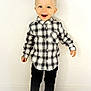 child, boy, smiling, plaid_shirt, black_pants, white_sneakers, standing, happy, indoor, casual_clothing, short_blond_hair, white_background, floor, portrait, cute, fashion, young, feet, full_body, person
