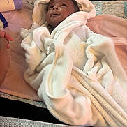 Azlyn joined the competition — help win amazing prizes! baby, baby_care, blanket, comfort, crib, cute, face, gaze, hand, indoor, infant, person, product, quilt, rest, skin, sleeping_area, soft, towel, white