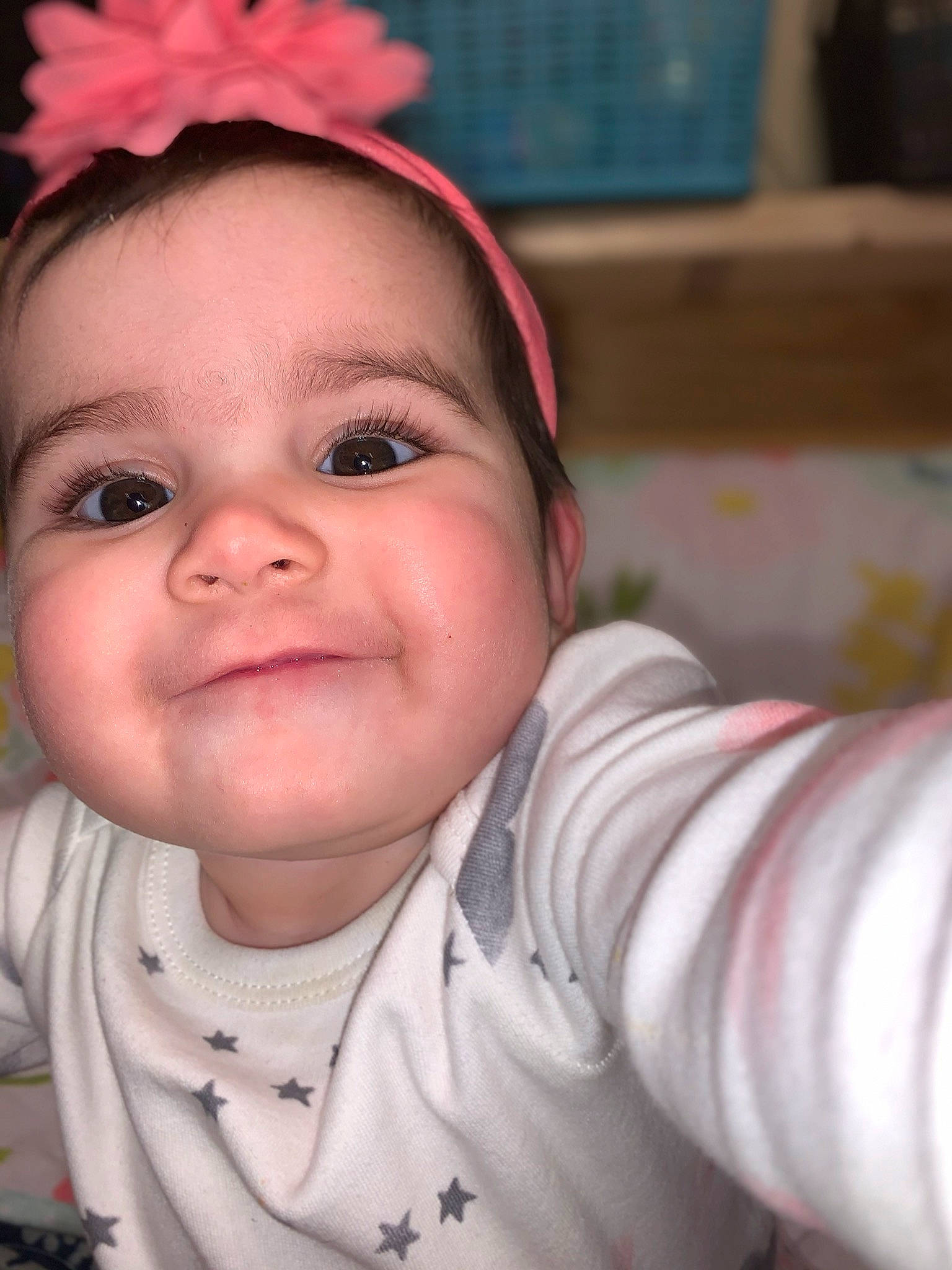 Brinleigh is registered to the contest to win money with this photo: baby, cheek, child, chin, eye, eyebrow, face, facial_expression, forehead, hair_accessory, happy, head, headgear, lip, mouth, nose, person, pink, skin, smile