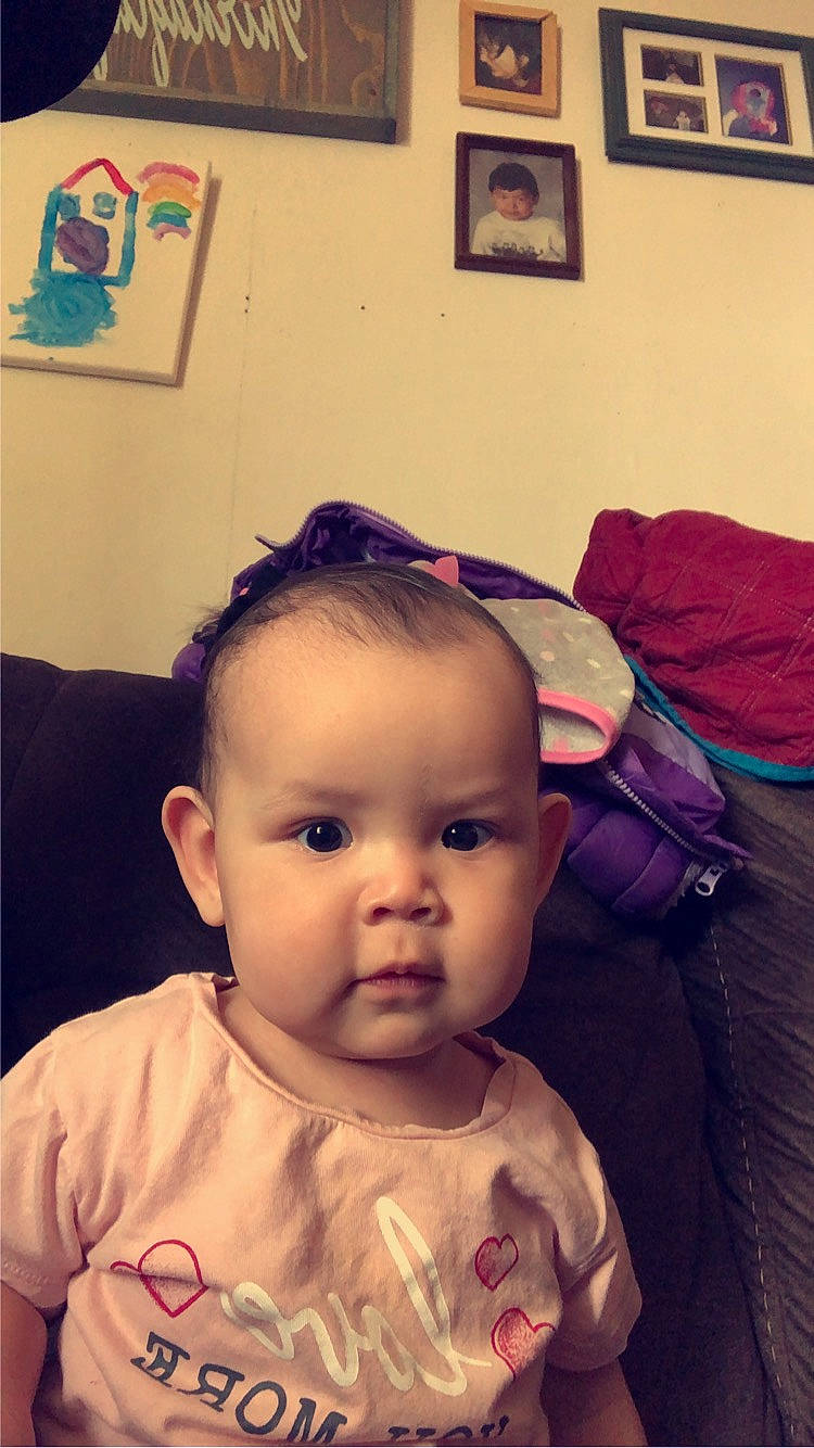 Raelynn is registered to the contest to win money with this photo: baby, baby_toddler_clothing, bag, cheek, child, chin, ear, eyebrow, eyelash, forehead, happy, iris, lip, luggage_and_bags, mouth, nose, person, picture_frame, sitting, skin