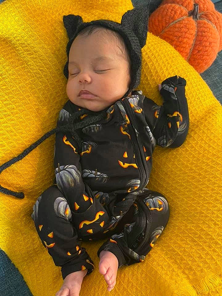 Violet is registered to the contest to win money with this photo: baby, baby_in_car_seat, baby_products, baby_safety, baby_sleeping, baby_toddler_clothing, car_seat, cheek, child, comfort, face, finger, flooring, linens, orange, person, sitting, skin, sleeve, toddler