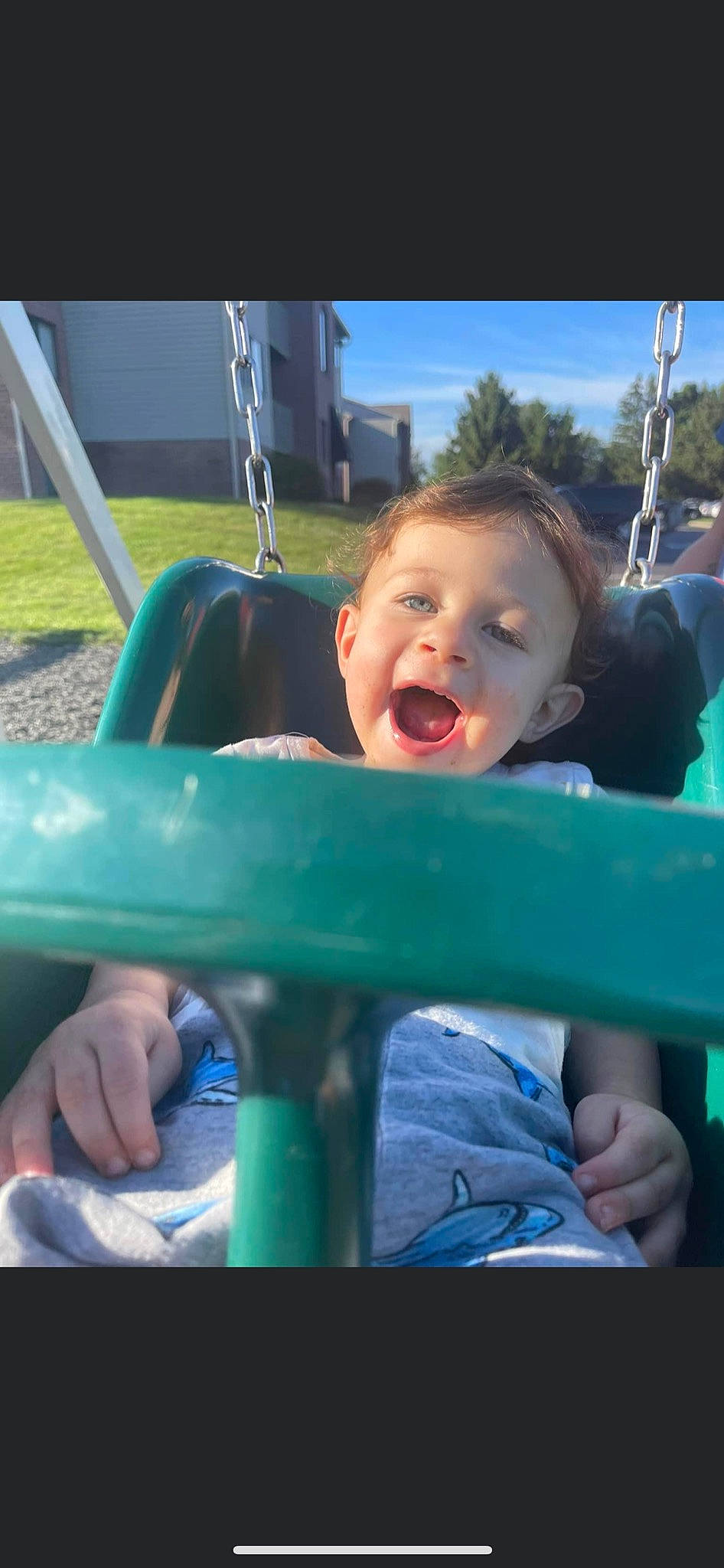 Asher joined the competition — help win amazing prizes! baby_products, baby_toddler_clothing, child, electric_blue, finger, fun, grass, happy, leisure, outdoor_play_equipment, person, play, recreation, sitting, sky, smile, swing, thumb, toddler, tree