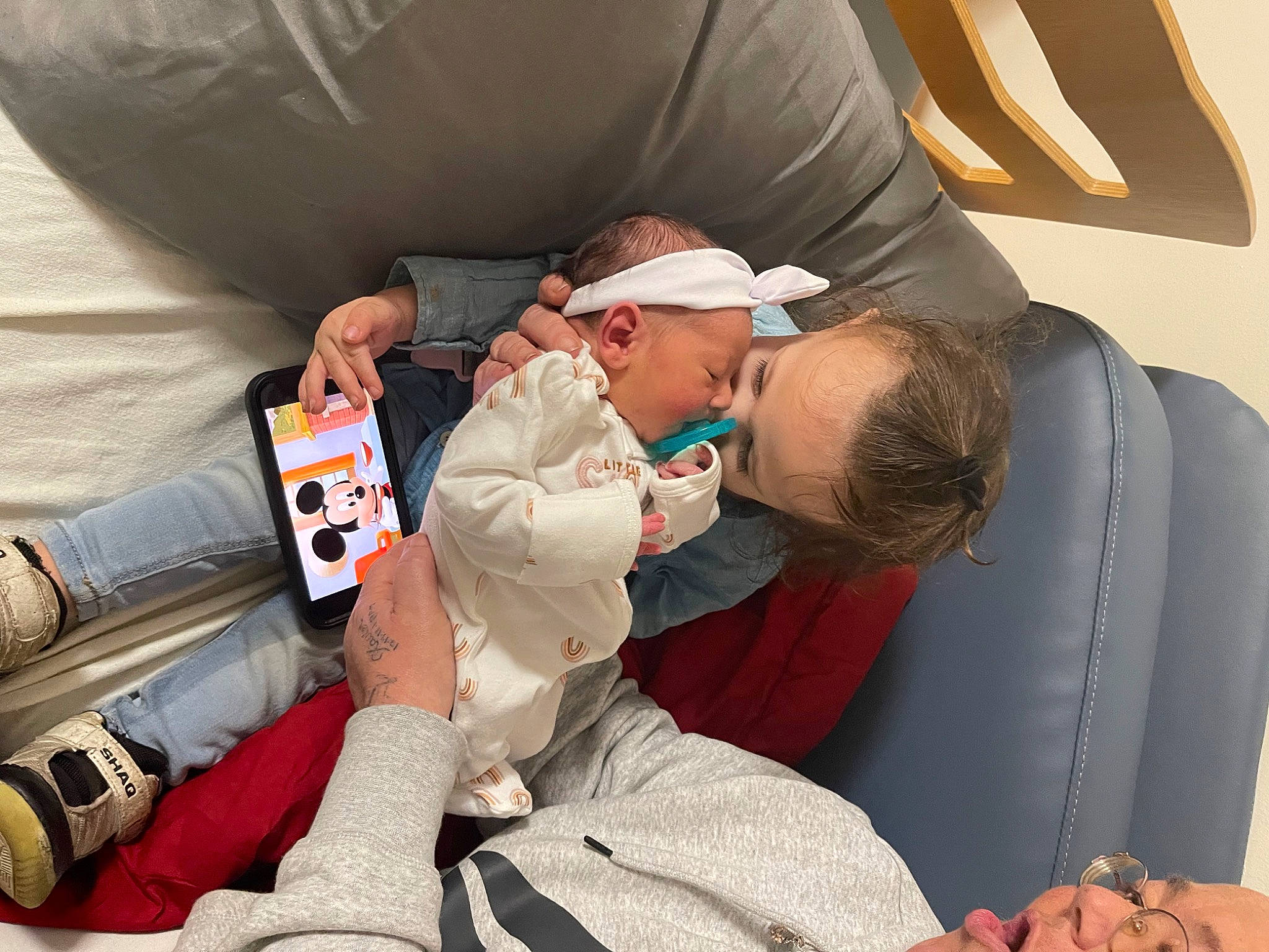 Adelaide is registered to the contest to win money with this photo: baby, baseball_cap, car_seat, carmine, child, comfort, event, eyewear, fun, hat, health_care, human_leg, lap, luxury_vehicle, nap, person, room, service, sitting, toddler