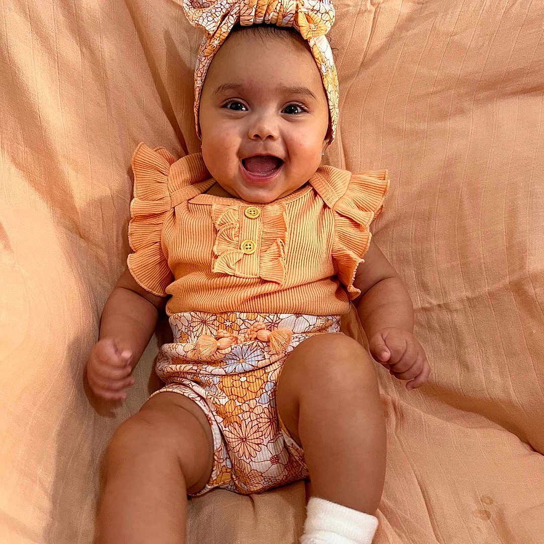 Kensley joined the competition — help win amazing prizes! accessories, baby, babylaughing, bonnet, clothing, dress, face, happy, hat, head, headband, hosiery, laughing, newborn, person, photography, portrait, sitting, smile, sock