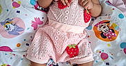 Jaliyah joined the competition — help win amazing prizes! baby, infant, pacifier, pink_clothing, crocheted_shoes, strawberry_design, blanket, cartoon_characters, lying_down, cute, child, indoors, soft_fabric, colorful, closeup, portrait, face, hands, feet, sleepwear