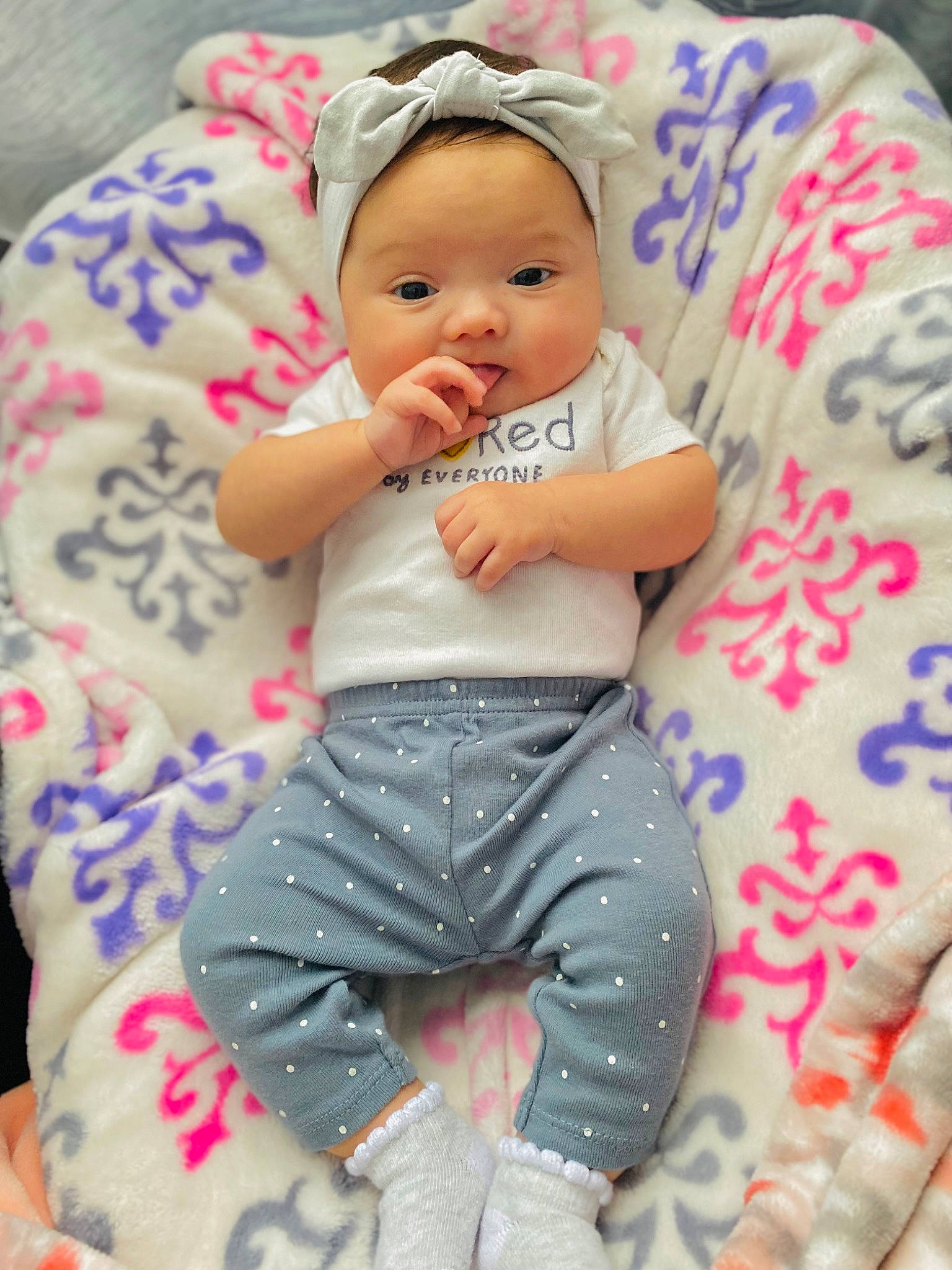 Kyloni is registered to the contest to win money with this photo: baby, baby_toddler_clothing, cap, cheek, child, comfort, face, facial_expression, fun, happy, head, headgear, linens, pattern, person, pink, skin, sleeve, smile, textile