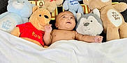 Shaurya is registered to the contest to win money with this photo: baby, bedtime, blanket, child, comfort, cozy, cuddly, cute, happy, indoor, infant, lying_down, plush_toy, portrait, resting, sleepover, smiling, soft_toy, teddy_bear, toy