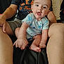 Landen joined the competition — help win amazing prizes! baby, bodypart, chair, clothing, couch, cushion, face, finger, furniture, hand, happy, head, homedecor, pants, person, photography, portrait, shorts, sitting, t_shirt
