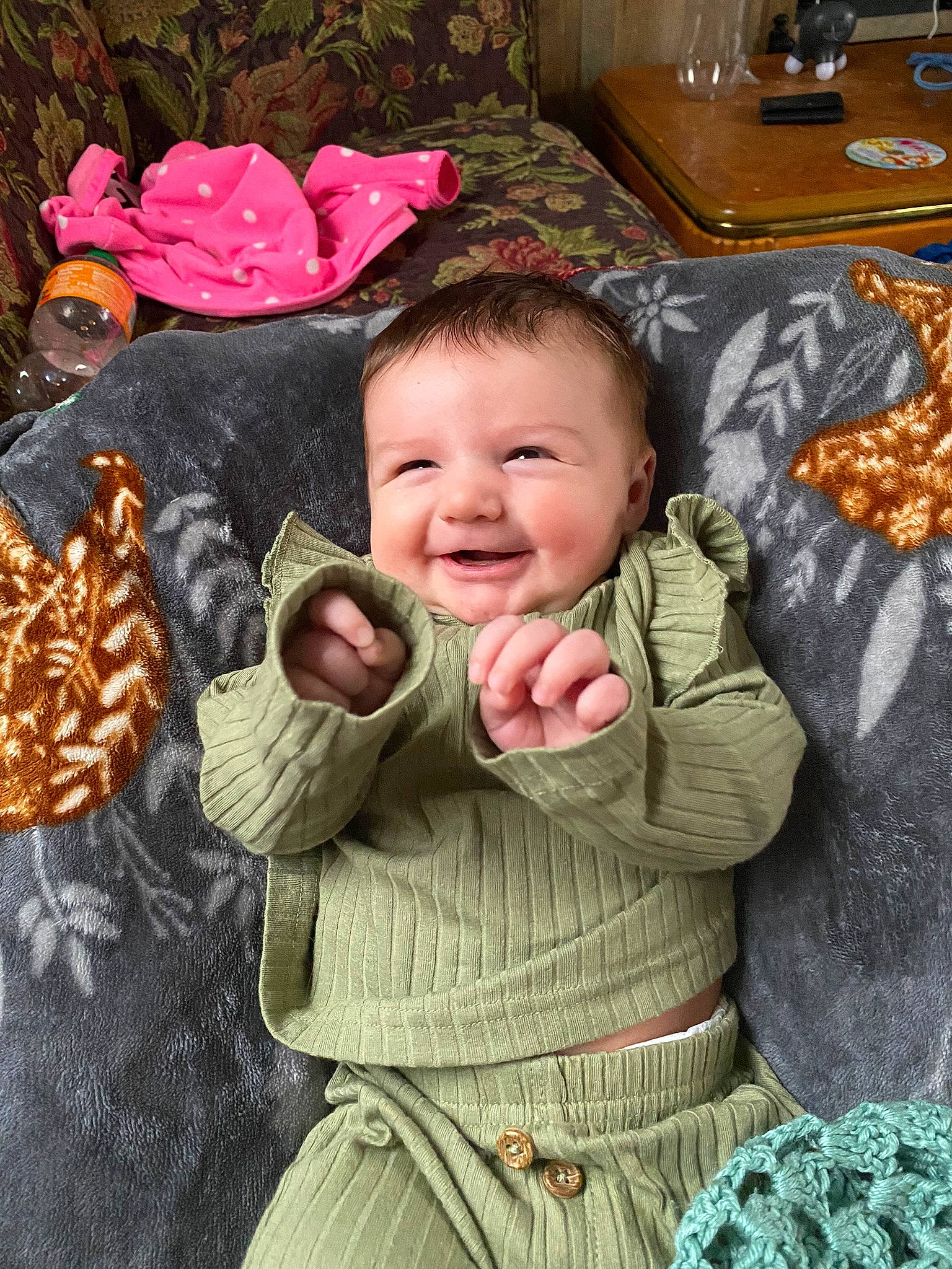 Delilah is registered to the contest to win money with this photo: baby, baby_toddler_clothing, cheek, child, eye, facial_expression, fur, grass, happy, joy, leaf, linens, pattern, people_in_nature, person, sitting, sleeve, smile, tableware, thumb