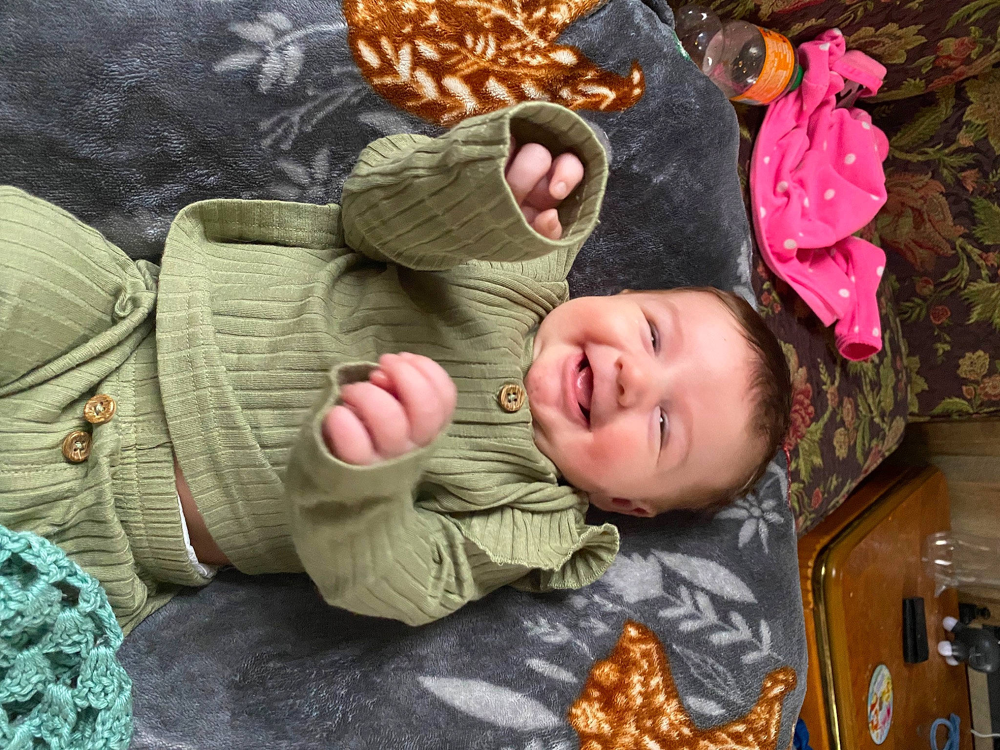 Delilah is registered to the contest to win money with this photo: baby, baby_toddler_clothing, cheek, child, comfort, eye, face, happy, head, headgear, human_body, joy, leg, linens, pattern, person, skin, smile, textile, toddler