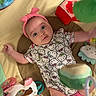 Lily is registered to the contest to win money with this photo: arms_outstretched, baby, child, colorful, curious, cute, happy, headband, hello_kitty, indoor, infant, lying_down, onesie, person, pink, play_mat, portrait, smiling, soft_toys, toy