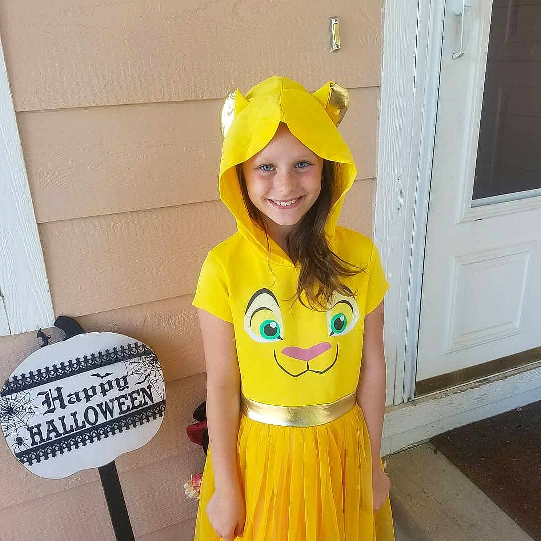 Brooklyn is registered to the contest to win money with this photo: child, clothing, costume, joy, outerwear, person, smile, t_shirt, toddler, yellow