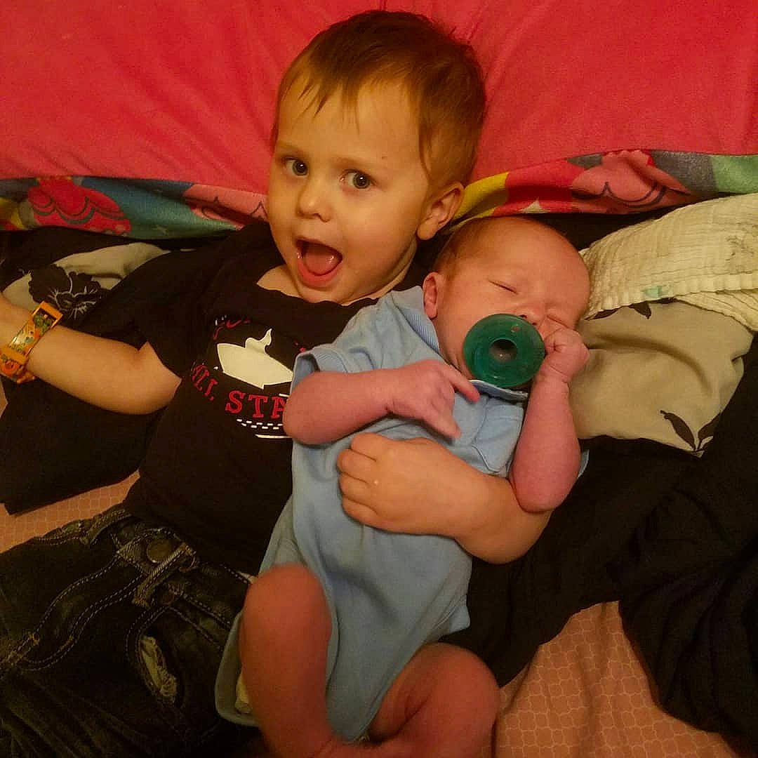 Liam joined the competition — help win amazing prizes! arm, baby, cheek, child, eye, finger, fun, hand, head, iris, leg, mouth, person, sitting, skin, smile, surprise, thumb, toddler