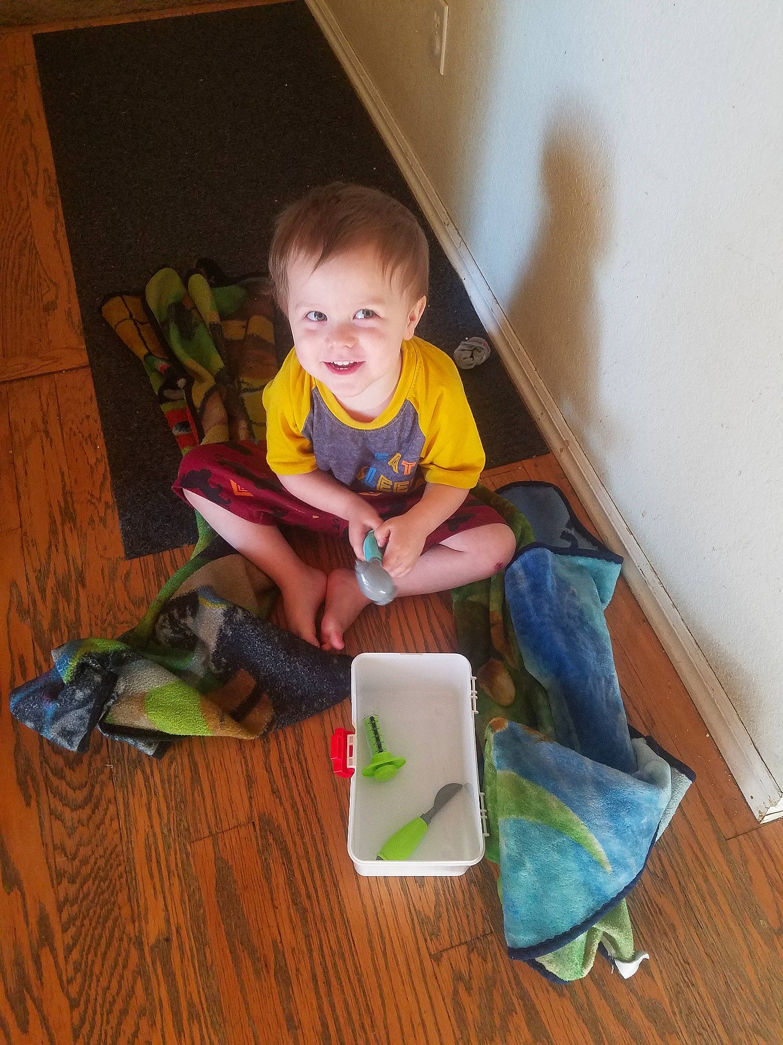 Liam is registered to the contest to win money with this photo: child, floor, flooring, person, play, sitting, toddler